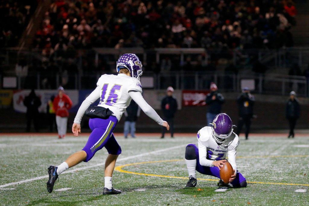 Lake Stevens kicker Macray Flanders hits the deciding 22-yard field goal with just over five minutes to play. (Ryan Berry / The Herald)
