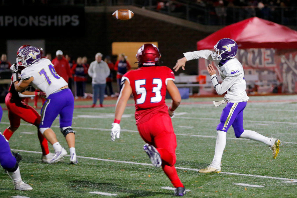 Lake Stevens quarterback Kolton Matson makes a pass over the middle against Kennedy Catholic during the Class 4A state championship game Saturday at Mount Tahoma Stadium in Tacoma. (Ryan Berry / The Herald)
