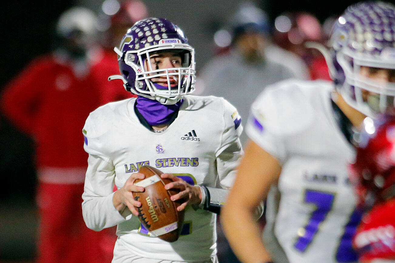 Lake Stevens quarterback Kolton Matson drops back to pass against Kennedy Catholic in the WIAA 4A State Football Championship game Saturday, Dec. 3, 2022, at Mount Tahoma Stadium in Tacoma, Washington. (Ryan Berry / The Herald)