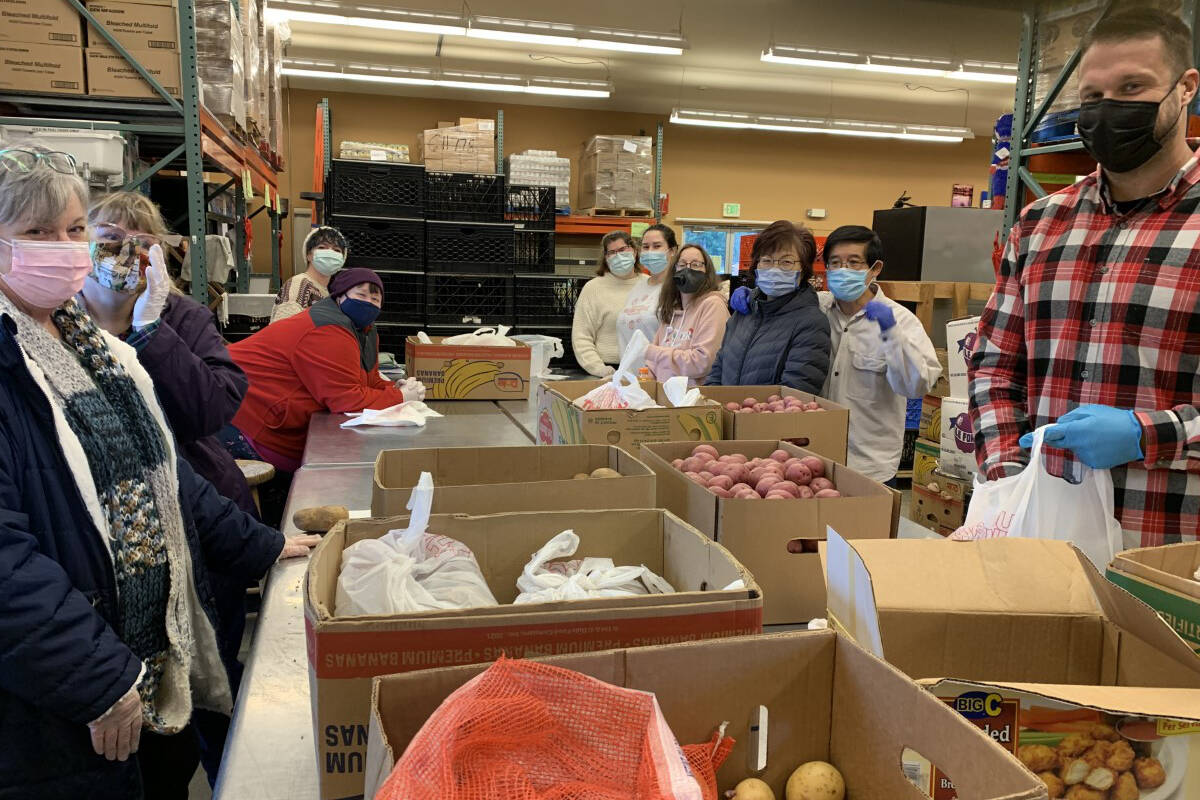 Village Experience Learning Center participants volunteering at Marysville Community Food Bank. - Photo courtesy of Village Community Services.