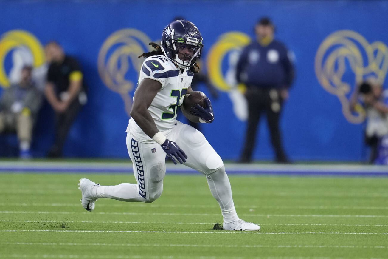Seattle Seahawks running back Tony Jones Jr. runs with the ball during the second half of an NFL football game against the Los Angeles Rams Sunday, Dec. 4, 2022, in Inglewood, Calif. (AP Photo/Marcio Jose Sanchez)