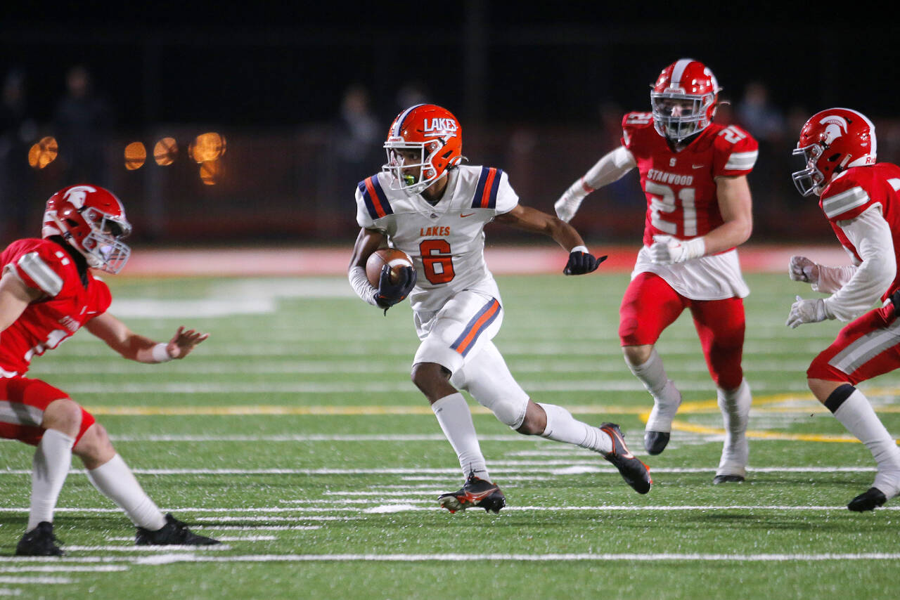 Lakes High School’s Aslan Fraser cuts through the secondary on a reception against Stanwood on Nov. 4, at Stanwood High School in Stanwood. (Ryan Berry / The Herald)
