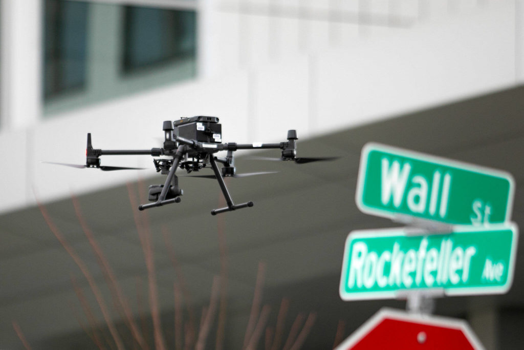 A one operated by law enforcement flies towards the Snohomish County Superior Courthouse during a lockdown Monday, in downtown Everett. (Ryan Berry / The Herald)
