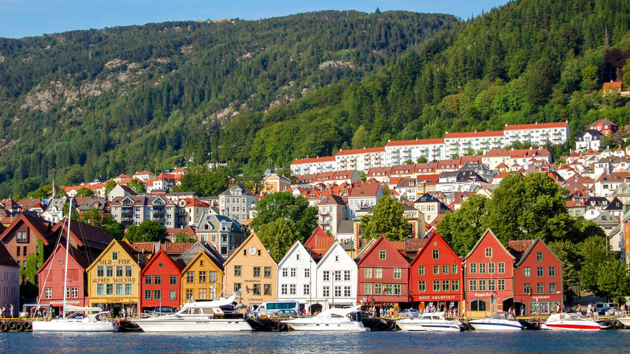 The colorful and somewhat tipsy old wooden commercial buildings of Bryggen line Bergen’s harborfront. Bryggen dates to medieval times when it was one of four principal trading posts in the Hanseatic League, a German-run trade confederation extending across northern and central Europe.