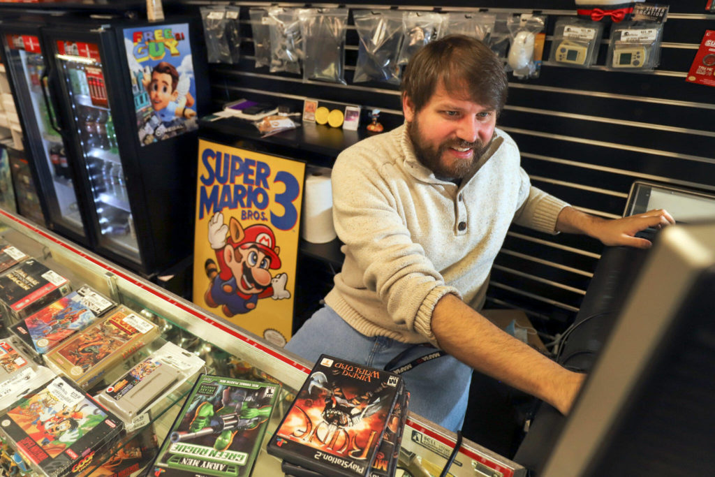Joshua Jacobson opened a video game store in Lake Stevens called Stupid Geeks as result of COVID. Jacobson needed a brick and mortar to contains his inventory. (Kevin Clark / The Herald)
