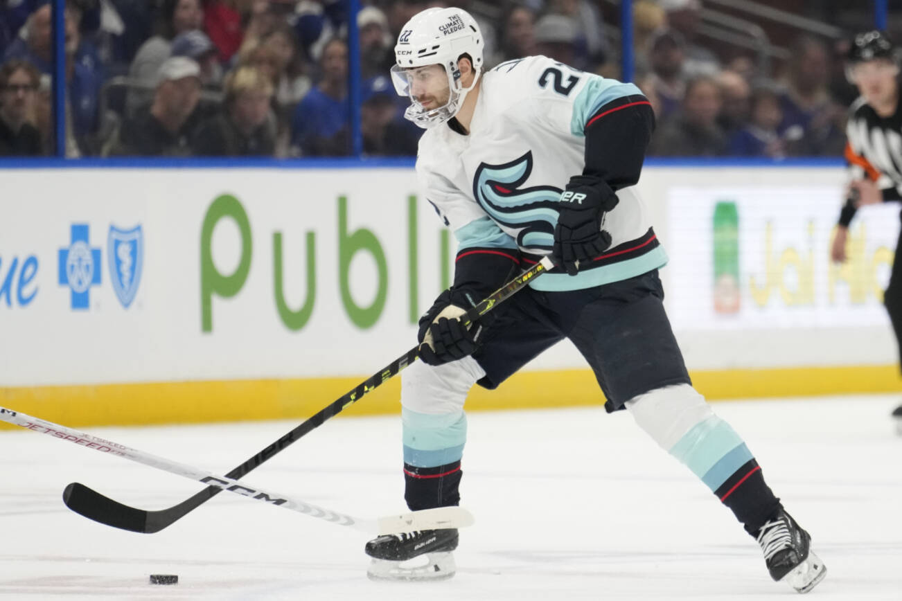 Seattle Kraken right wing Oliver Bjorkstrand (22) against the Tampa Bay Lightning during the first period of an NHL hockey game Tuesday, Dec. 13, 2022, in Tampa, Fla. (AP Photo/Chris O'Meara)