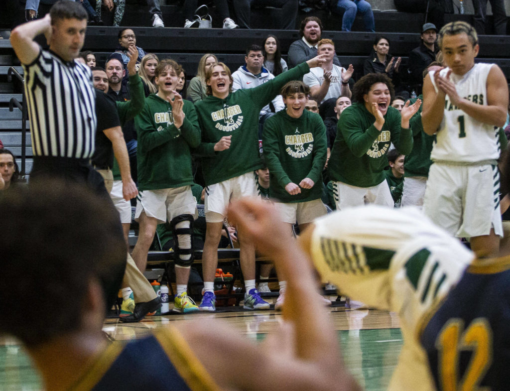 The Marysville Getchell bench reacts to a foul call during the game against Shorecrest on Friday, Dec. 16, 2022 in Maryville, Washington. (Olivia Vanni / The Herald)
