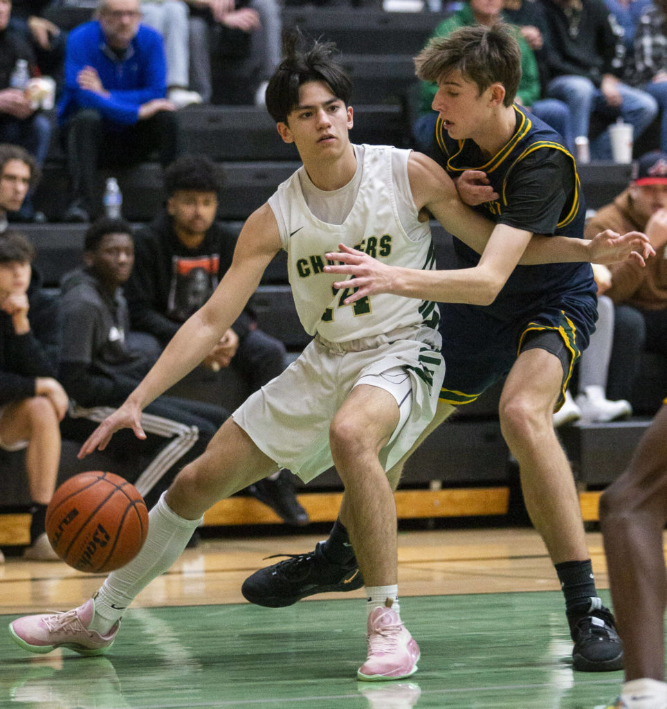 Marysville Getchell’s Blain Palacol tries to get around a Shorecrest player during the game on Friday, Dec. 16, 2022 in Maryville, Washington. (Olivia Vanni / The Herald)
