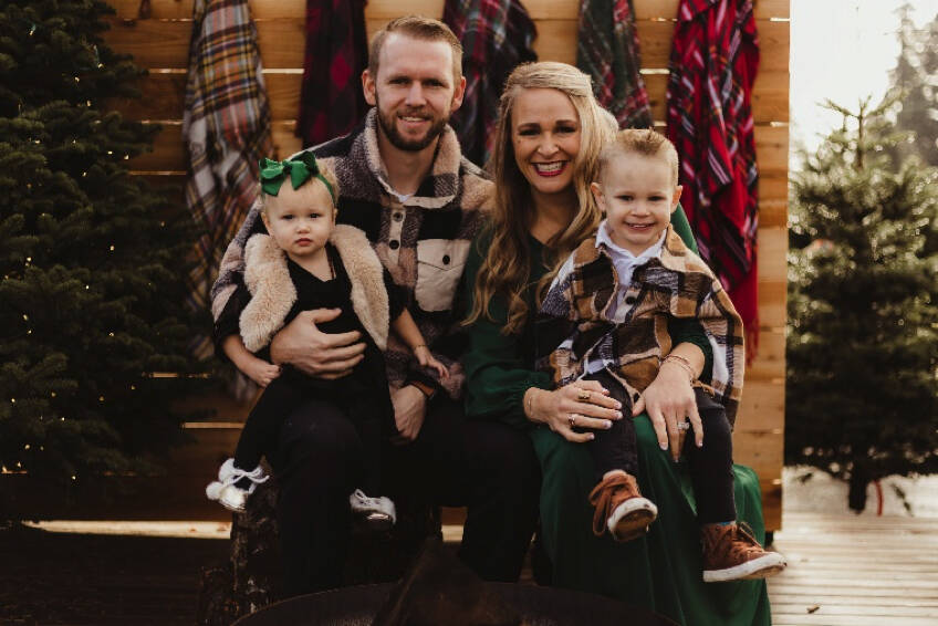 Sarah and her family posing for their holiday photos.