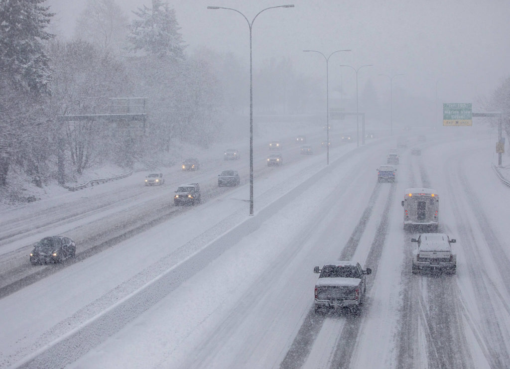 Traffics moves slowly along I-5 through Everett on Tuesday, in Everett. (Olivia Vanni / The Herald) 
