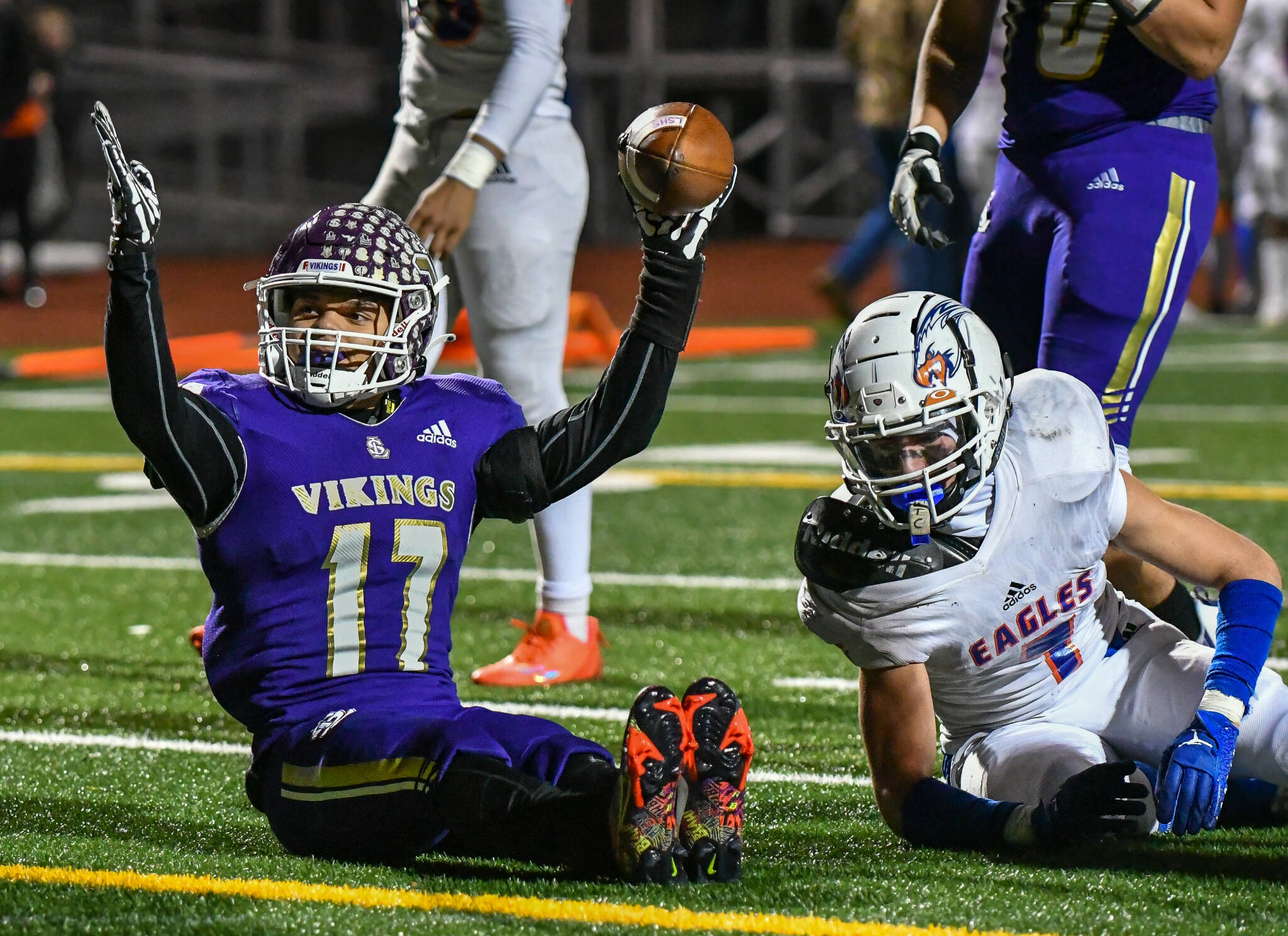 Lake Stevens running back Jayden Limar (left) celebrates after scoring a touchdown in last month’s 4A state semifinals. (John Gardner / Pro Action Image)