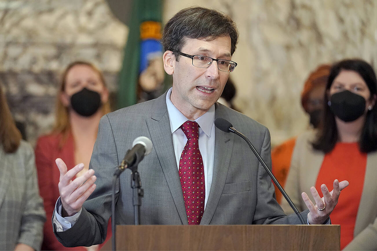 FILE - Washington Attorney General Bob Ferguson speaks March 23, 2022, at the Capitol in Olympia, Wash. Months into a complex trial over their role in flooding Washington with highly addictive painkillers, the nation's three largest opioid distributors have agreed to pay the state $518 million. Ferguson announced the deal Tuesday, May 3, 2022. (AP Photo/Ted S. Warren, File)