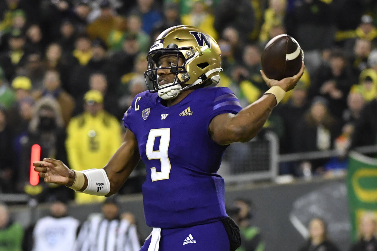 Washington quarterback Michael Penix Jr. (9) passes against Oregon during the second half of an NCAA college football game Saturday, Nov. 12, 2022, in Eugene, Ore. (AP Photo/Andy Nelson)