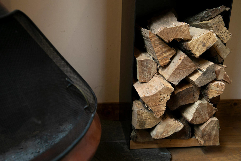 Firewood is stored all over at Canyon Creek Cabins on Sep. 23, in Granite Falls. (Ryan Berry / The Herald)
