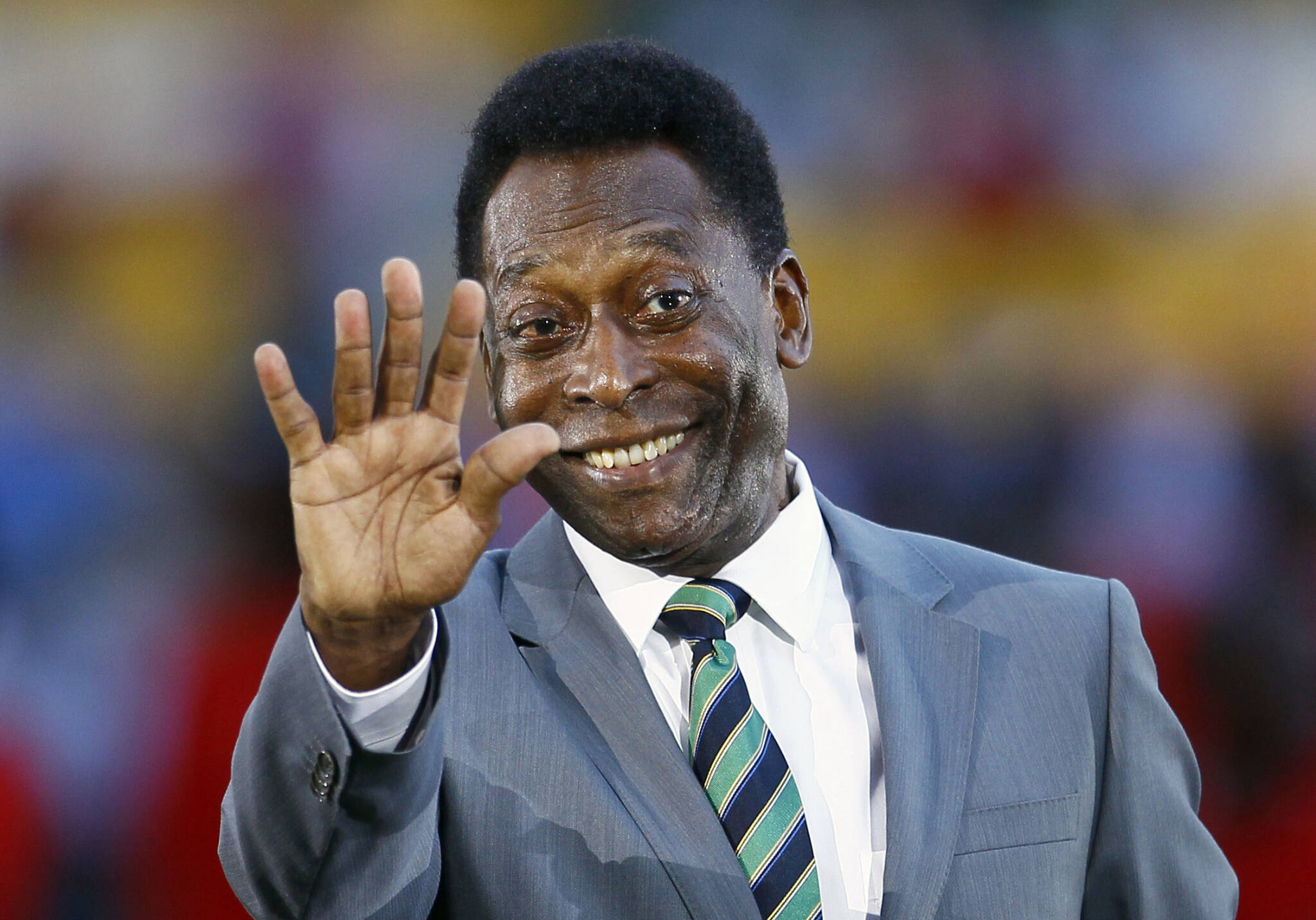 Brazilian soccer legend Pele waves prior to the African Cup of Nations final soccer match between Ivory Coast and Zambia at Stade de L’Amitie in Libreville, Gabon, Feb. 12, 2012. Pelé, the Brazilian king of soccer who won a record three World Cups and became one of the most commanding sports figures of the last century, died in Sao Paulo on Thursday. He was 82. (AP Photo/Francois Mori, File)