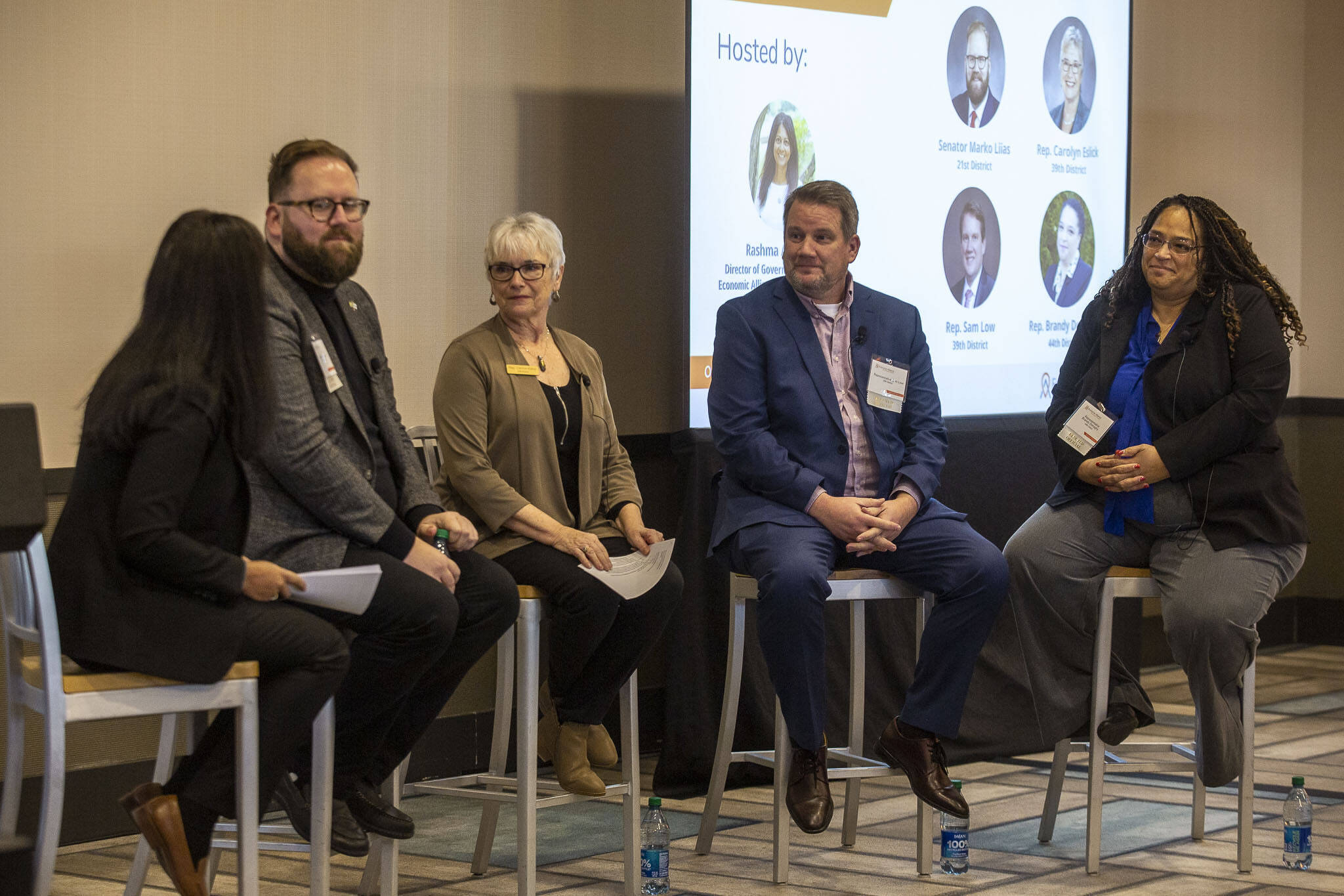 Left to right, EASC Director of Governmental Relations Rashma Agarwal, Sen. Marko Liias, D-Everett, Rep. Carolyn Eslick, R-Sultan, Rep. elect Sam Low, and Rep. Brandy Donaghy, D-Everett talk on a panel during the Economic Alliance Snohomish County 2023 Legislative Kick-off on Thursday, at Hotel Indigo in Everett. (Annie Barker / The Herald)