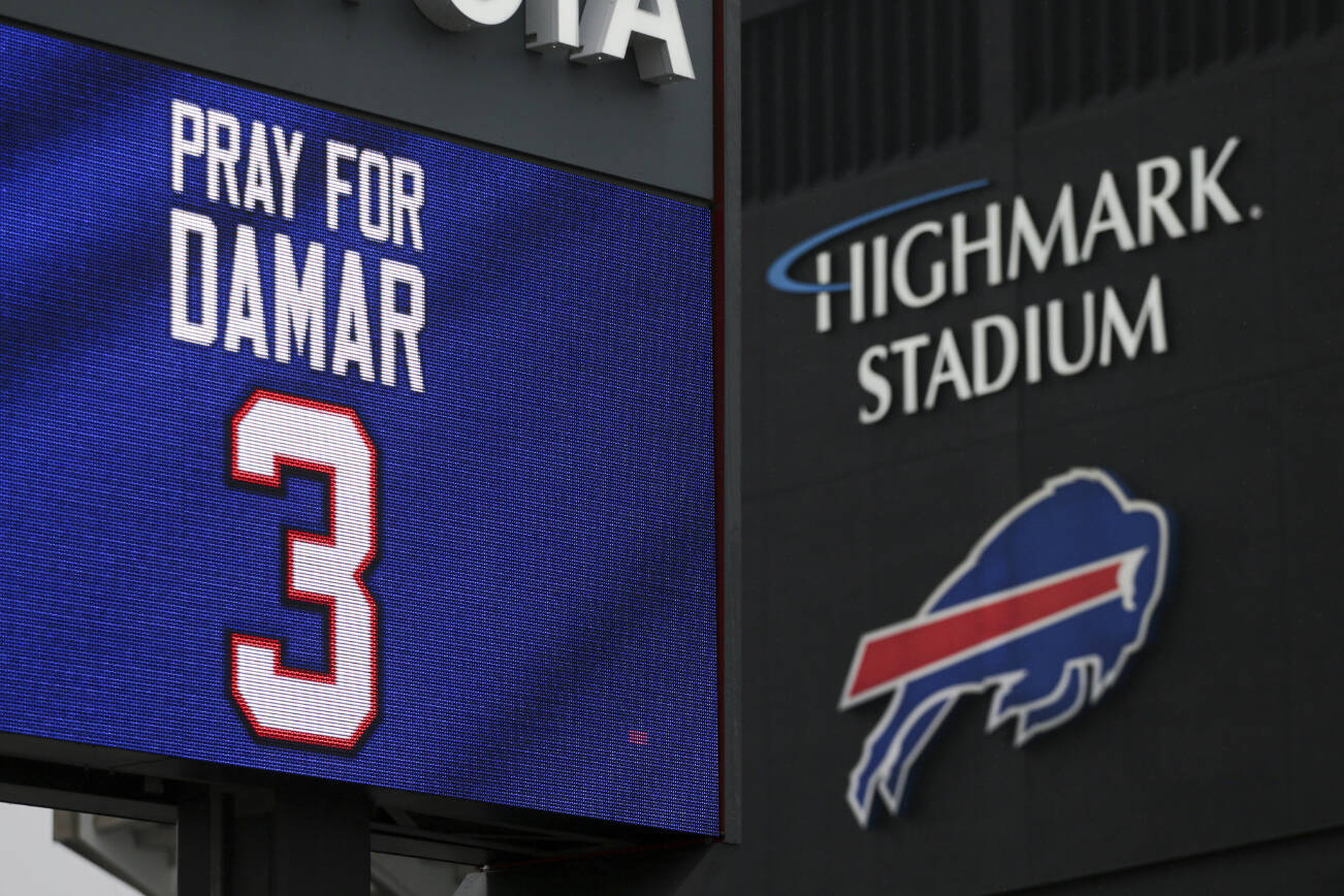A sign shows support for Buffalo Bills safety Damar Hamlin outside Highmark Stadium on Tuesday, Jan. 3, 2023, in Orchard Park, N.Y. Hamlin was taken to the hospital after collapsing on the field during an NFL football game against the Cincinnati Bengals on Monday night in Cincinnati. (AP Photo/Joshua Bessex)