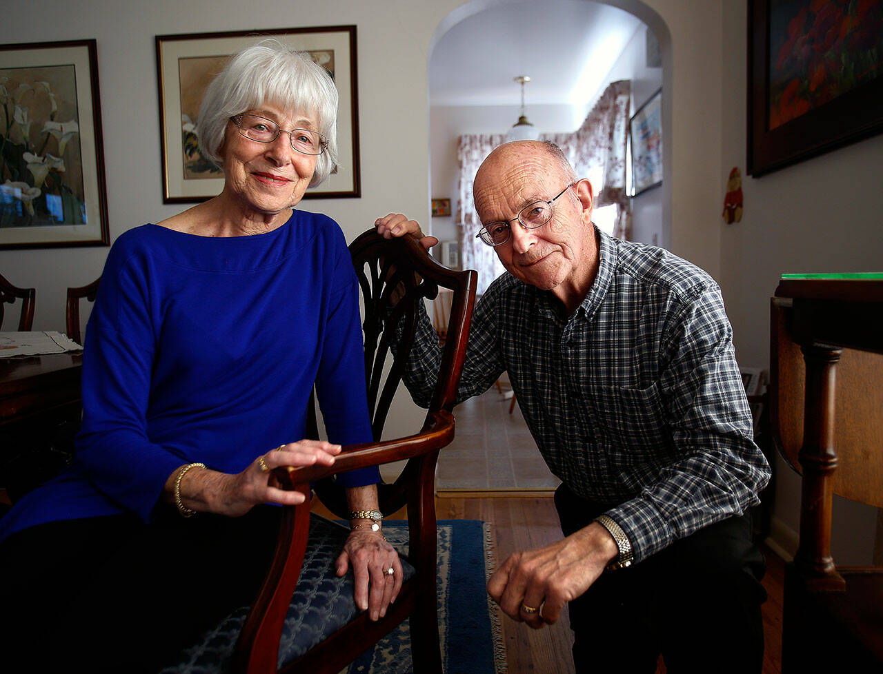 Retired educators Ed and Betty Morrow, both in their 80s in this photo taken April 19, 2016, relax at their home in Everett. (Dan Bates / Herald file)