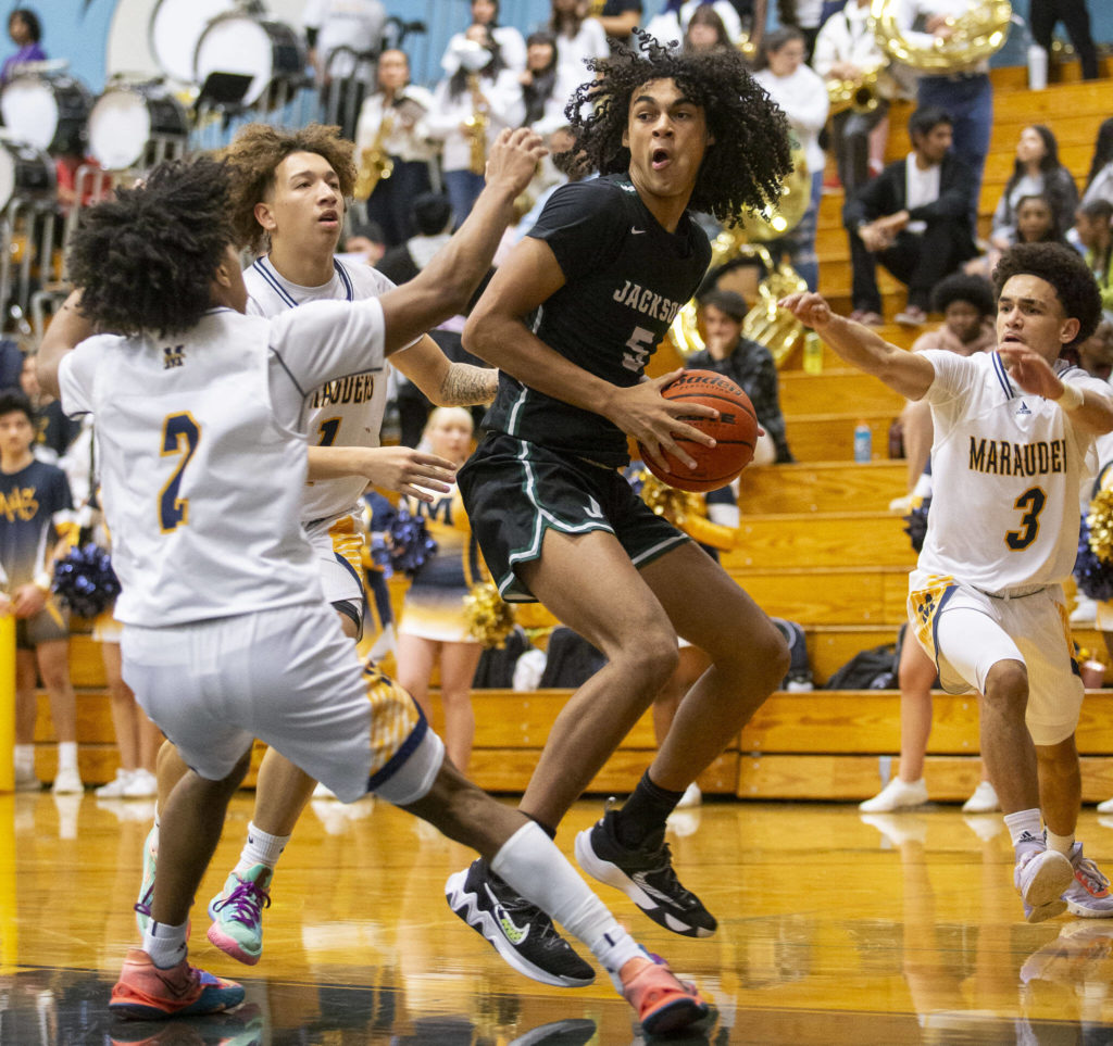 Jackson’s Sylas Williams posts up with the ball during a game against Mariner on Wednesday in Everett. (Olivia Vanni / The Herald)
