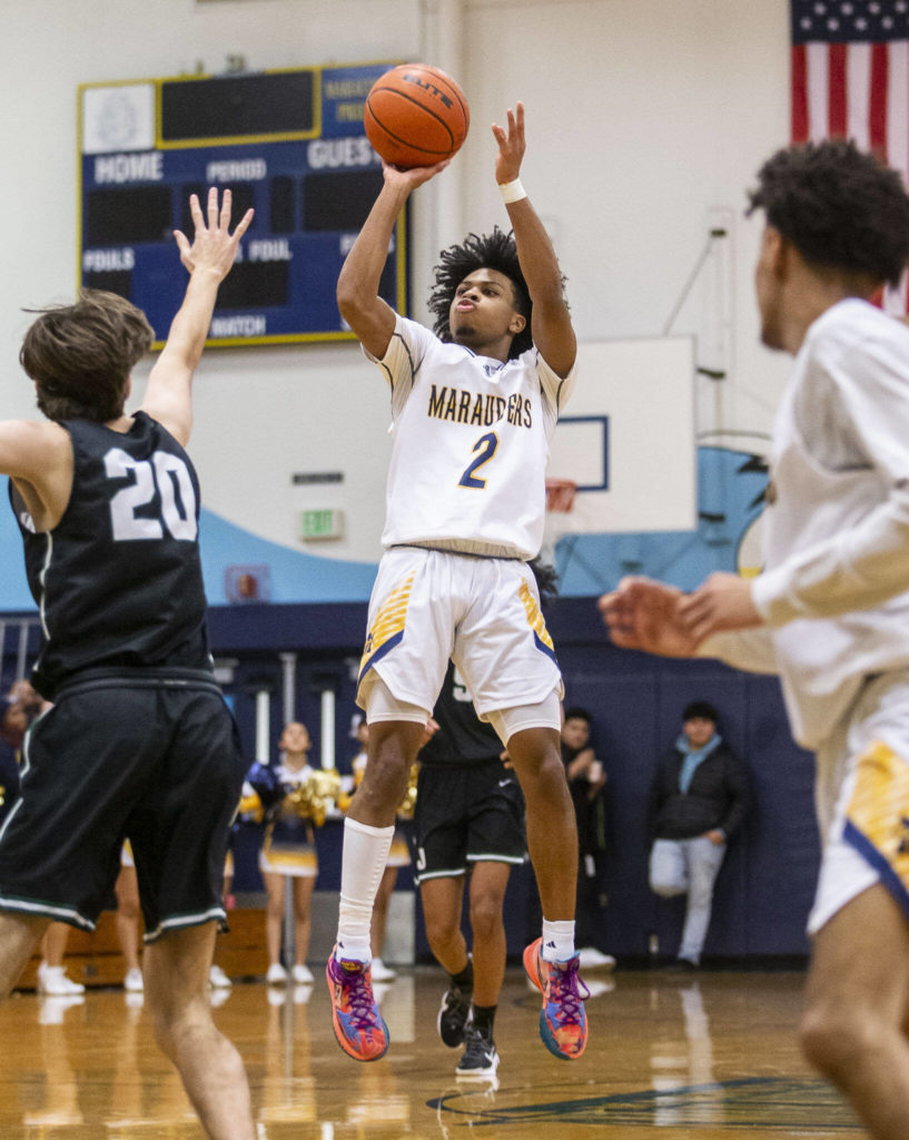 Mariner’s Jailin Johnson makes a 3-point shot during the game against Jackson on Wednesday in Everett. (Olivia Vanni / The Herald)
