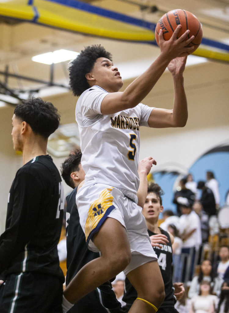 Mariner’s Makai Bloomfield makes a layup during the game against Jackson on Wednesday in Everett. (Olivia Vanni / The Herald)
