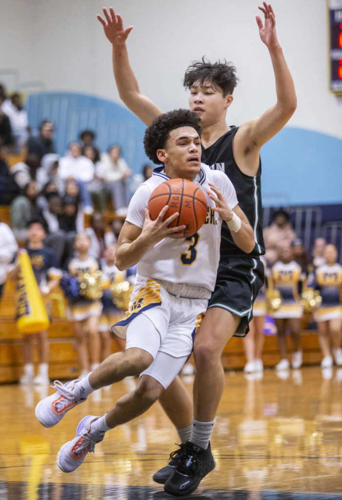 Mariner’s Macky James drives to the hoop during the game on Wednesday in Everett. (Olivia Vanni / The Herald)
