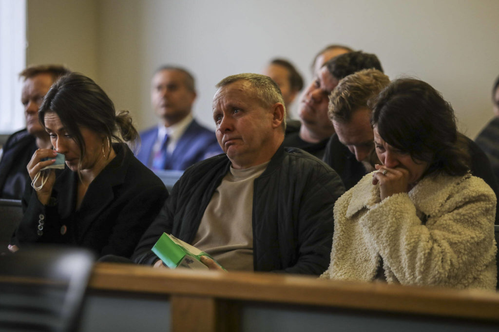 People listen during the sentencing of Ilya Hrudzko, who drove into a tree in Stanwood in 2020 and killed his passenger, on Monday at Snohomish County Superior Court in Everett. (Annie Barker / The Herald)
