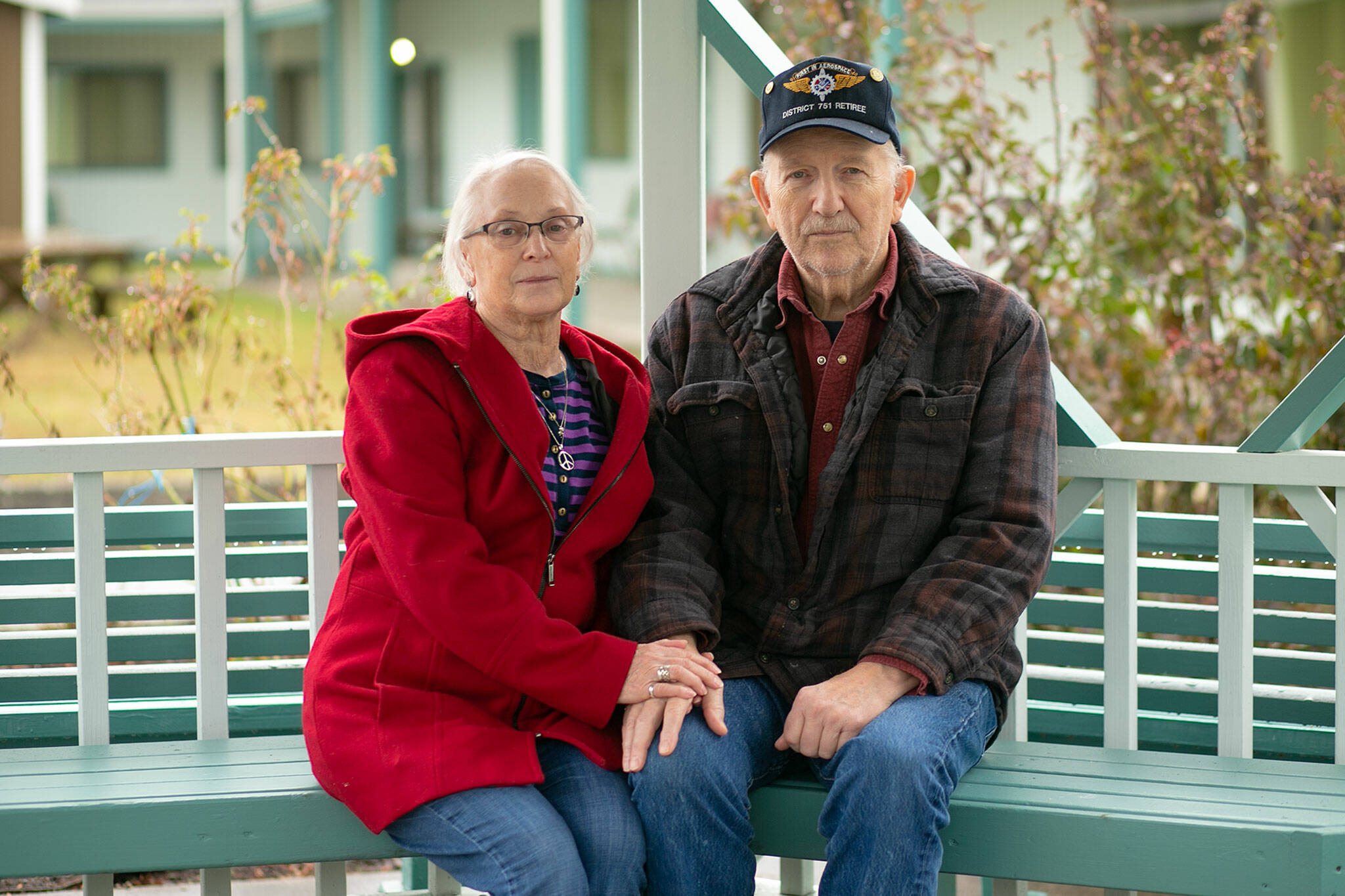 Jo Ford, 74, and her husband Bernard Ford, 80, sit together beneath a gazebo at the Stilly Valley Center on Saturday, Jan. 7, 2023, in Arlington, Washington. The couple has been married for 52 years and have both received medical care from The Everett Clinic for most of their lives. They are now looking for other care providers because of confusing and incorrect information from the clinic during its ongoing contract dispute with Regence over Medicare Advantage plans. (Ryan Berry / The Herald)