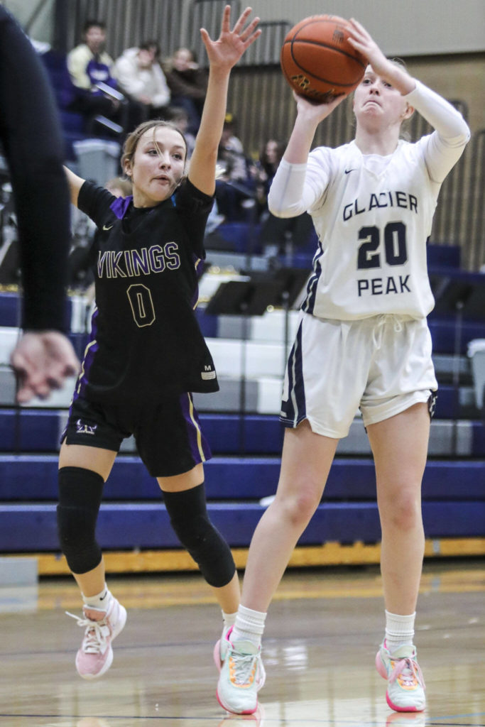 Glacier Peak’s Zoey Ritter (20) shoots the ball during a game between the Lake Stevens Vikings and Glacier Peak Grizzlies on Friday in Snohomish. The Grizzlies won 51-32. (Annie Barker / The Herald)
