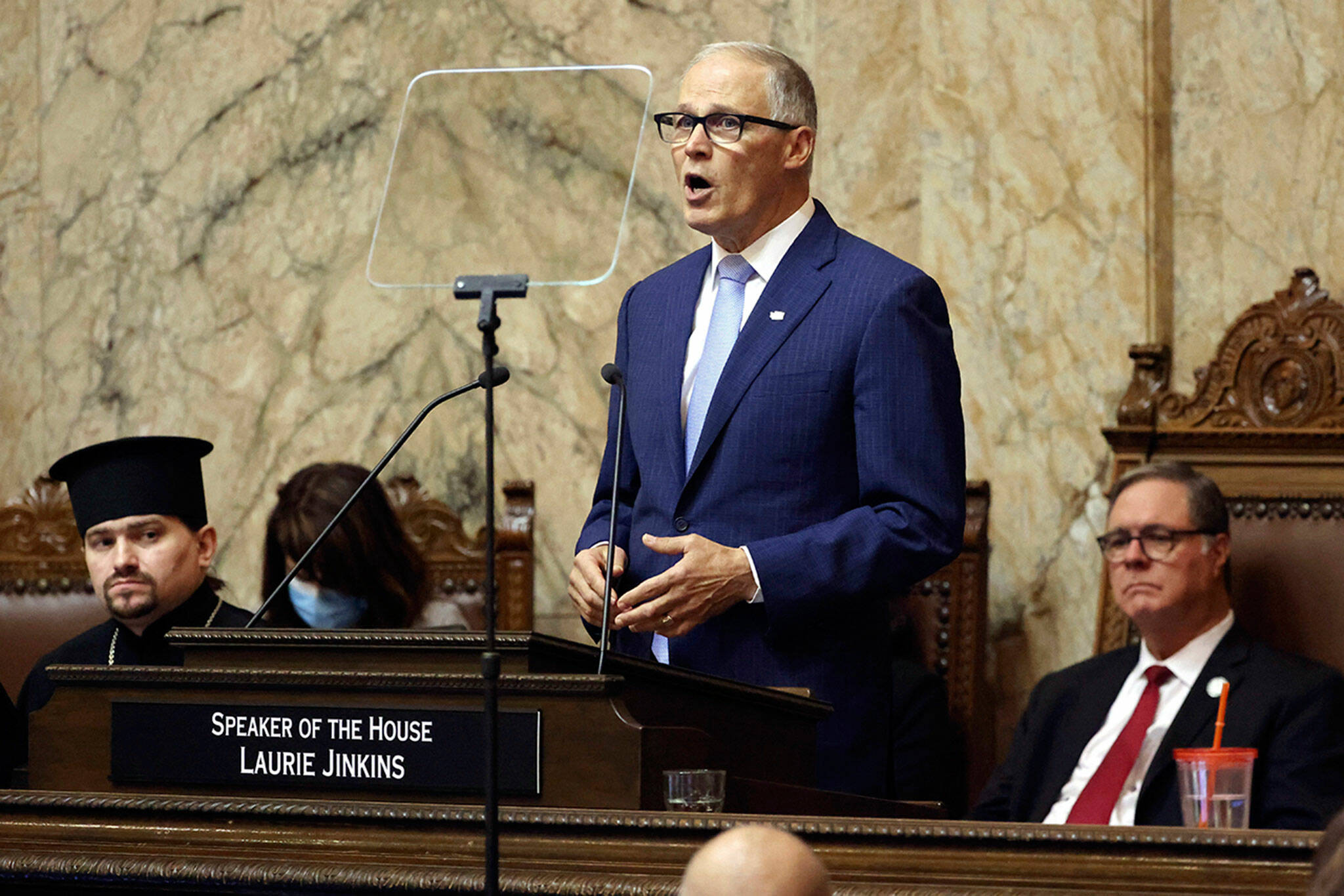 Washington Gov. Jay Inslee delivers his 2023 State of the State address at the Capitol in Olympia, on Tuesday. (Karen Ducey / The Seattle Times via AP)