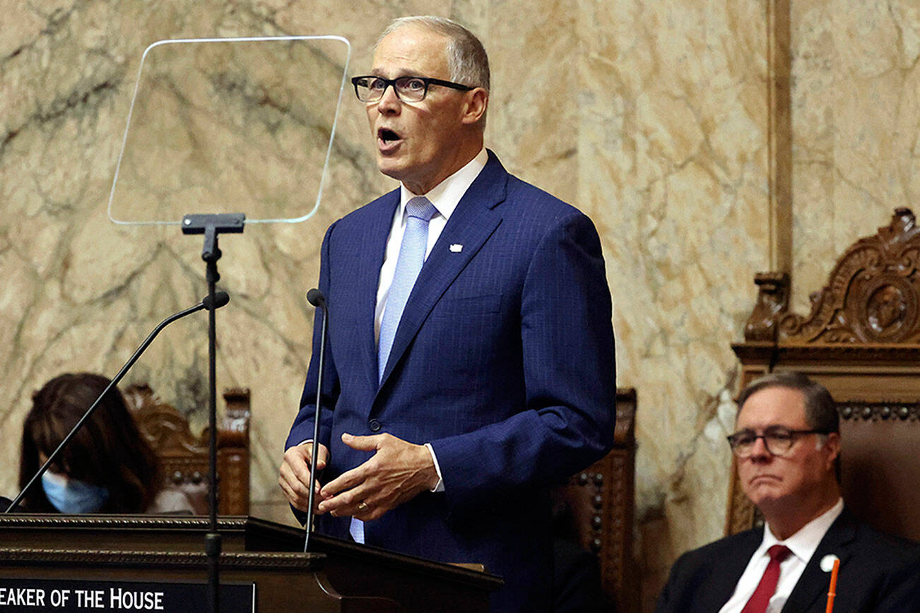 Washington Gov. Jay Inslee delivers his 2023 State of the State address at the Capitol in Olympia, Wash., on Tuesday, Jan. 10, 2023. (Karen Ducey/The Seattle Times via AP)