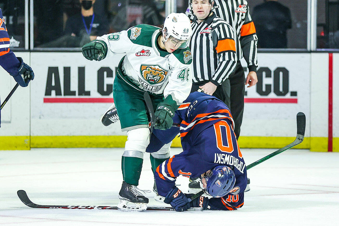 Everett Silvertips' Olen Zellweger (48) takes down the Kamloops Blazers' Luke Toporowski during a game on Saturday, Feb. 12, 2022, at Angel of the Winds Arena in Everett. (Kristin Ostrowski / Everett Silvertips)