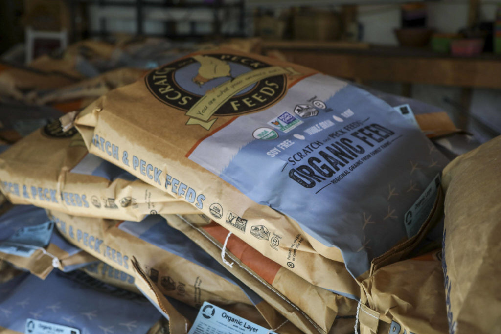 Organic feed sits in the garage at Hearth and Haven Farm in Monroe, Washington on Wednesday, Jan. 11, 2023. (Annie Barker / The Herald)
