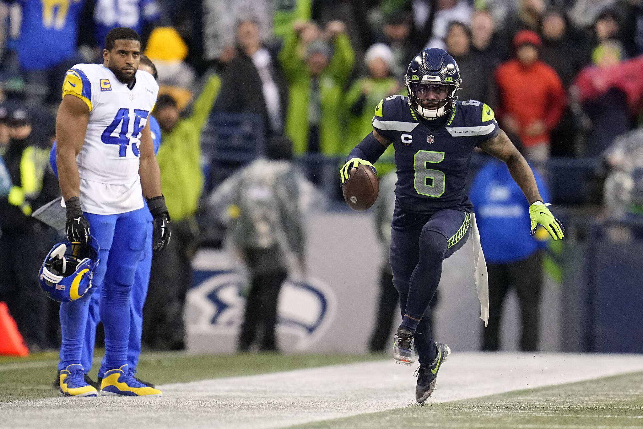 Seahawks safety Quandre Diggs (6) celebrates after intercepting a pass as Rams linebacker Bobby Wagner (45) looks on during overtime of a game Sunday in Seattle. (AP Photo/Abbie Parr)