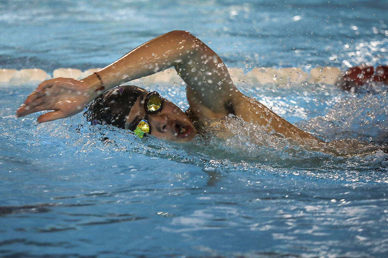 Kamiak’s Bryan Zi Wong wins the second heat of the 100 yard backstroke during the Jackson vs. Kamiak boys swim and dive meet at West Coast Aquatics in Mill Creek, Washington on Tuesday Jan. 10, 2023.  (Annie Barker / The Herald)