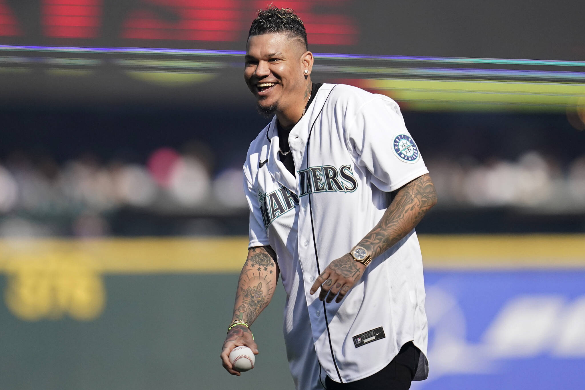 Former Mariners pitcher Felix Hernandez throws out the first pitch before Game 3 of an American League Division Series game between the Mariners and Astros on Oct. 15, 2022, in Seattle. (AP Photo/Abbie Parr)