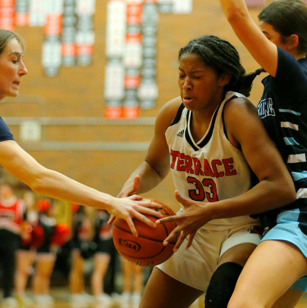 Mountlake Terrace’s Sierra Sonko gets the ball stripped away from her while driving in the paint against Meadowdale on Wednesday, Jan.11, 2023, at Mountlake Terrace High School in Mountlake Terrace, Washington. (Ryan Berry / The Herald)
