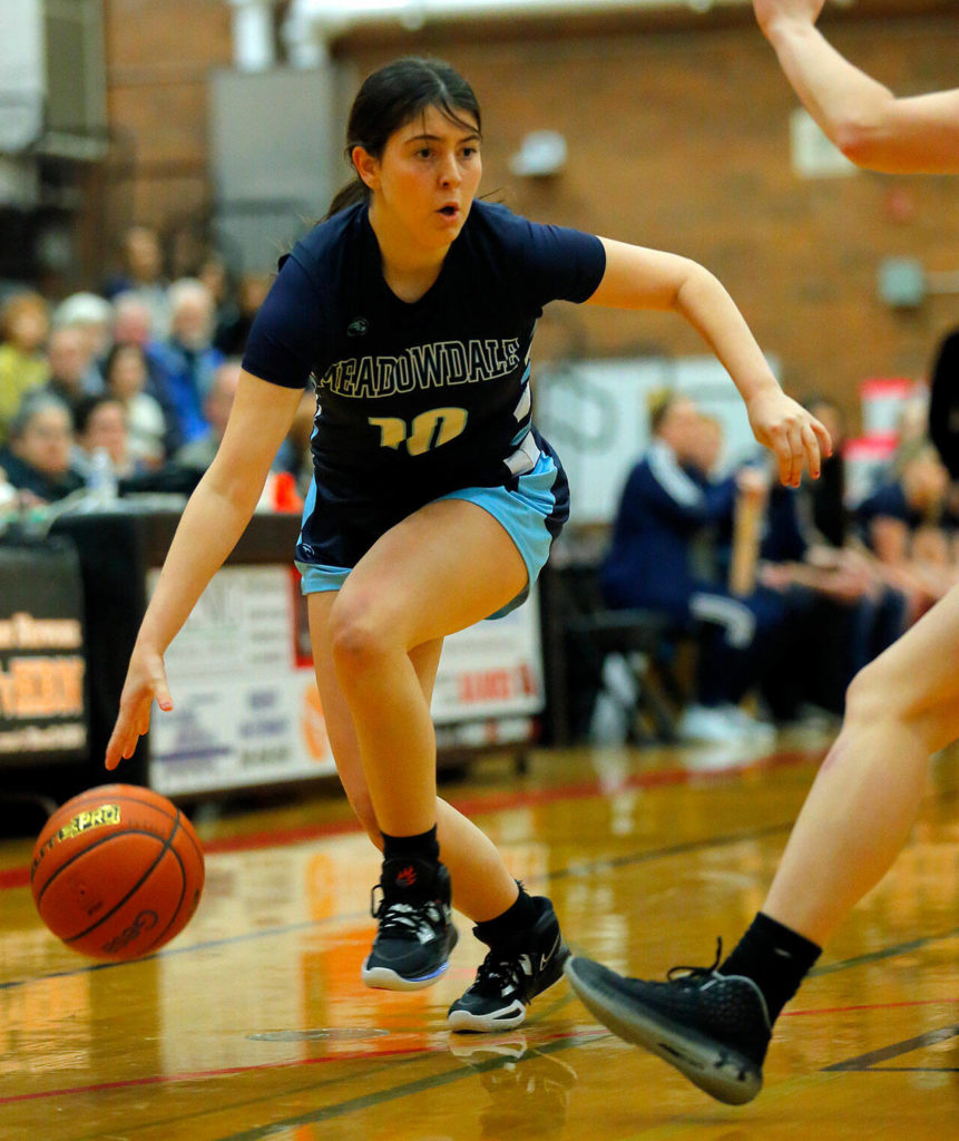 Meadowdale’s Natalie Durbin tries to take the ball to the baseline against Mountlake Terrace on Wednesday, Jan.11, 2023, at Mountlake Terrace High School in Mountlake Terrace, Washington. (Ryan Berry / The Herald)
