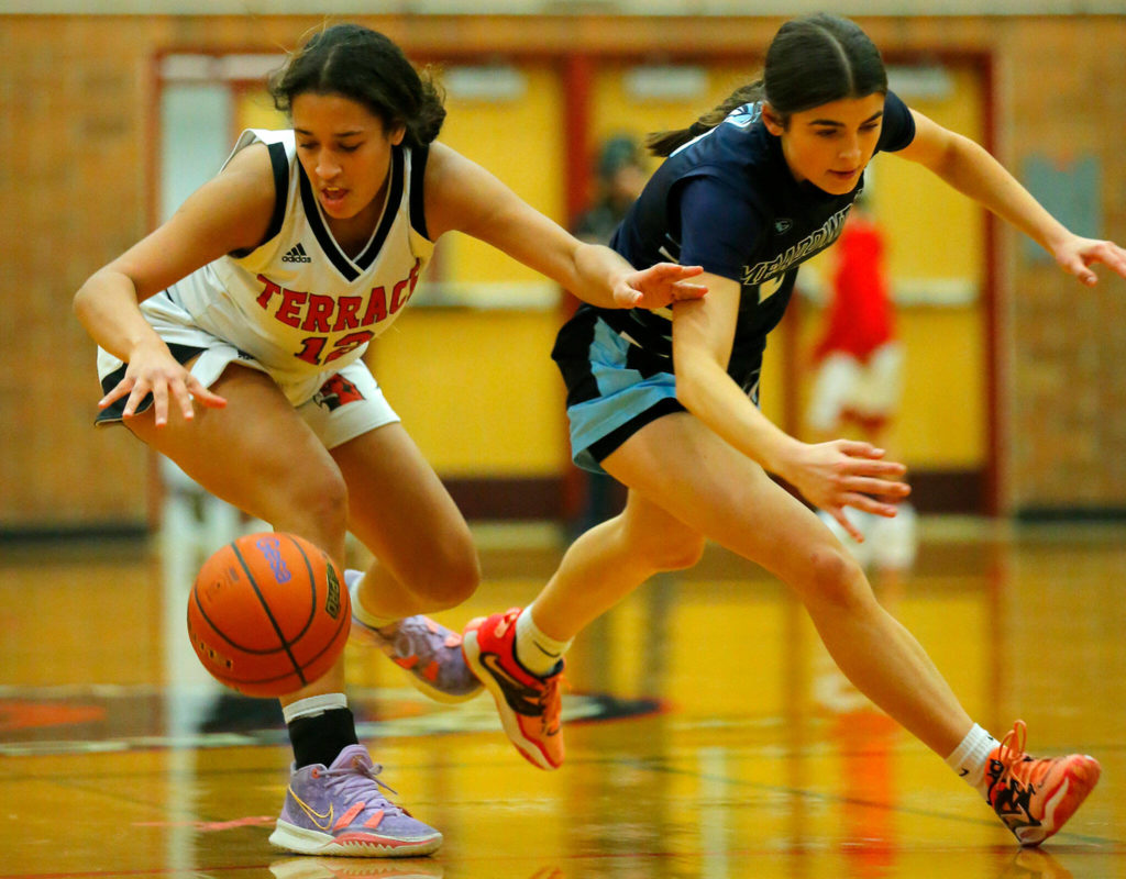 Mountlake Terrace’s Mya Sheffield comes away with a loose ball against Meadowdale on Wednesday, Jan.11, 2023, at Mountlake Terrace High School in Mountlake Terrace, Washington. (Ryan Berry / The Herald)

