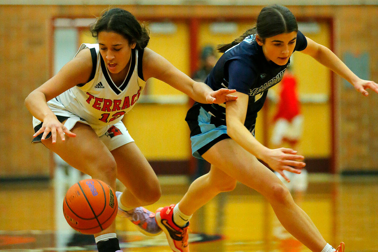 Mountlake Terrace’s Mya Sheffield comes away with a loose ball against Meadowdale on Wednesday, Jan.11, 2023, at Mountlake Terrace High School in Mountlake Terrace, Washington. (Ryan Berry / The Herald)