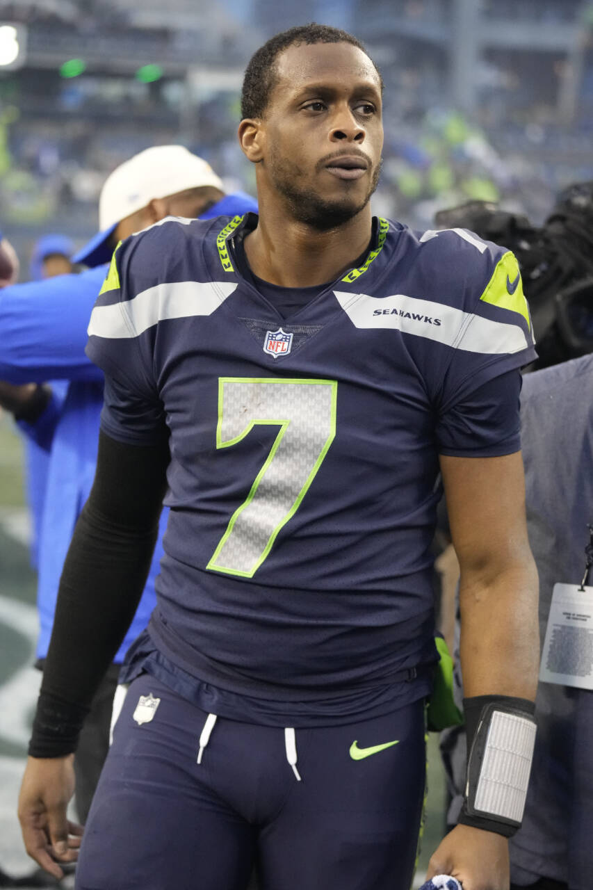 Seahawks quarterback Geno Smith walks off the field after a 19-16 overtime win over the Rams this past Sunday in Seattle. (AP Photo/Ben VanHouten)