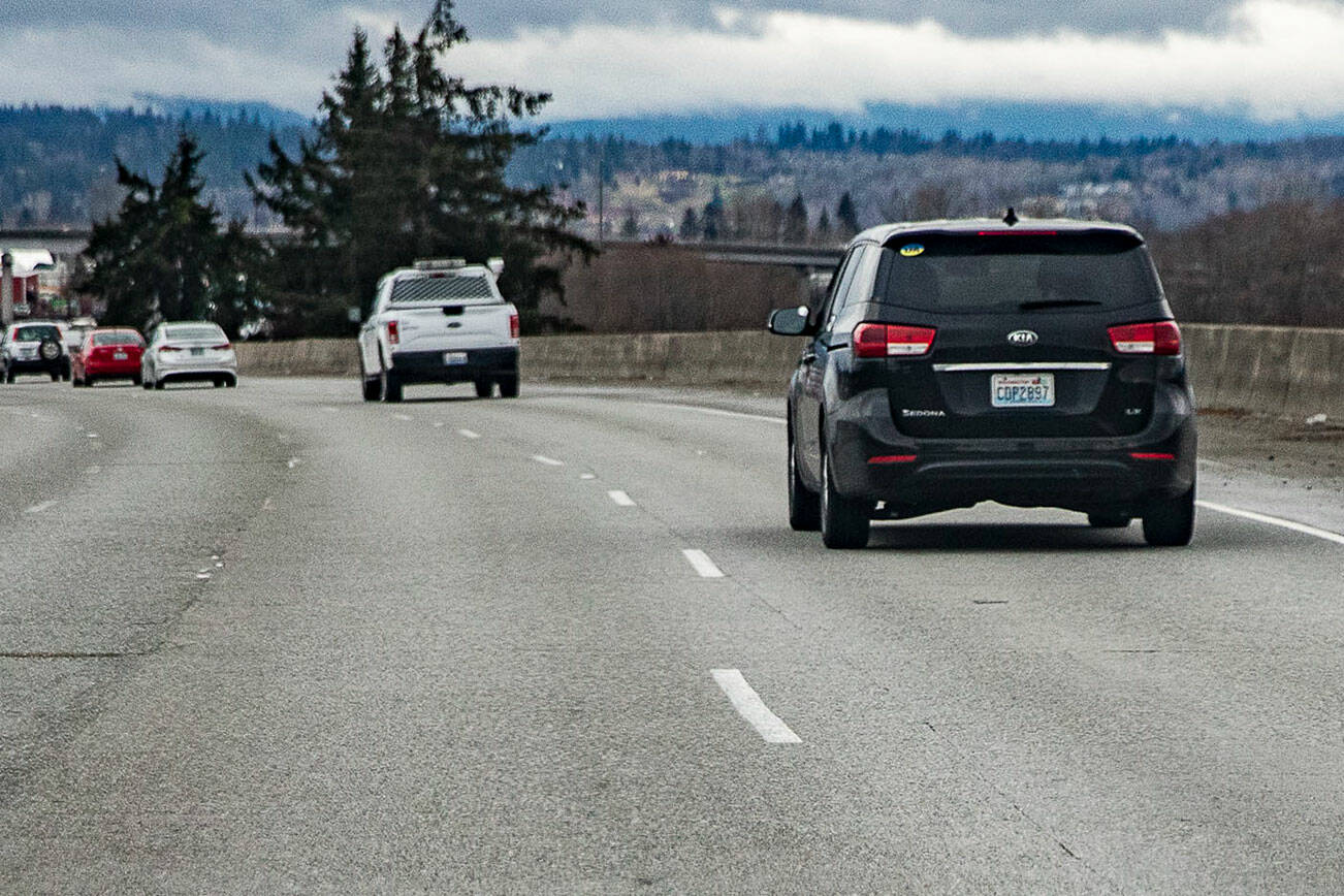 A white lane line juts out of place along I-5 northbound through Everett on Tuesday, Jan. 17, 2023. (Olivia Vanni / The Herald)