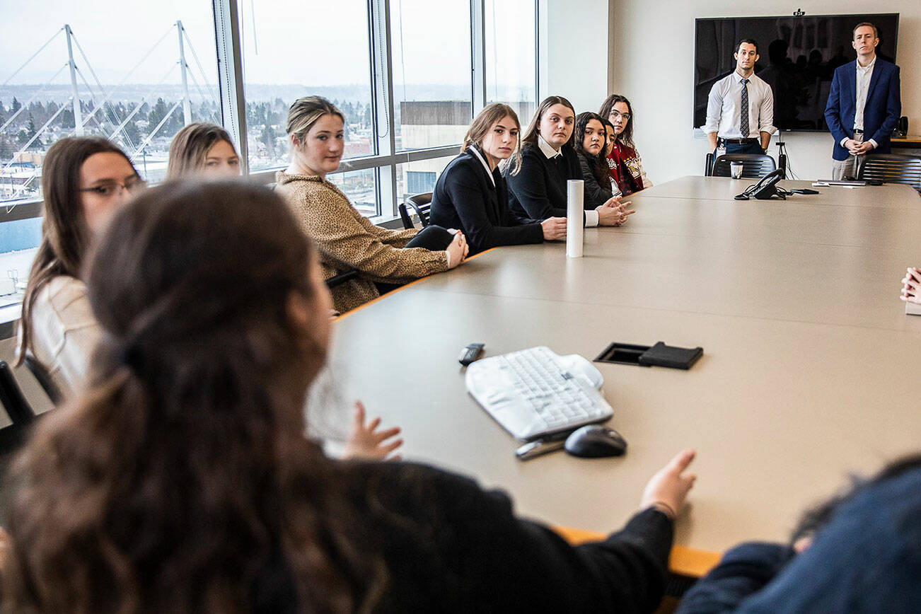 Marysville Pilchuck High School students talk with Snohomish County council members Jared Mead and Nate Nate Nehring during a Civic Engagement Day event hosted at the county campus on Thursday, Jan. 12, 2023 in Everett, Washington. (Olivia Vanni / The Herald)