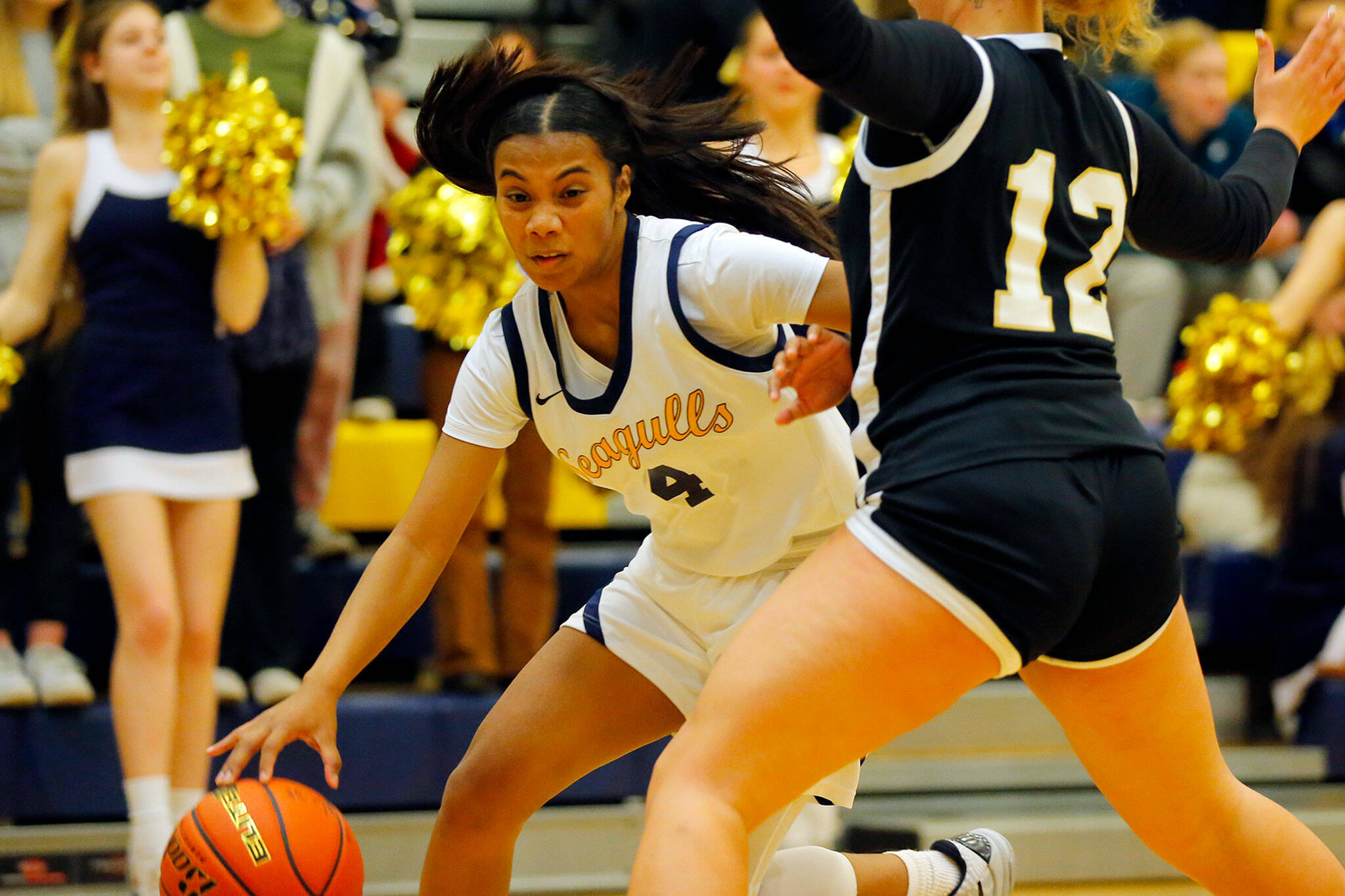 Everett’s Mylie Wugemgeg comes down with a rebound and looks to dribble up the court against Lynnwood on Thursday, Dec. 15, 2022, at Norm Lowery Gymnasium in Everett, Washington. (Ryan Berry / The Herald)