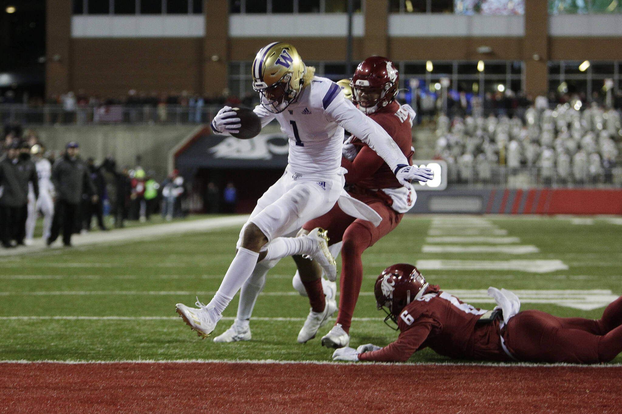 Washington wide receiver Rome Odunze (1) runs for a touchdown during the second half of the Apple Cup rivalry game against Washington State on Nov. 26, 2022, in Pullman. (AP Photo/Young Kwak)