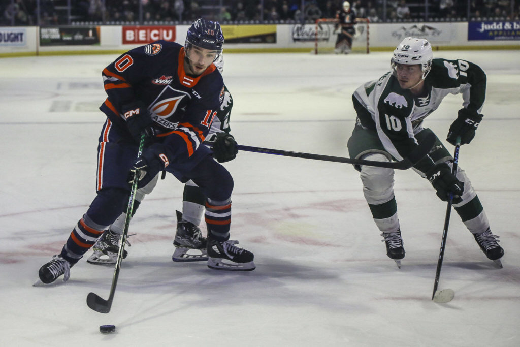 Kamloops’ Ryan Hofer (10) and Silvertips’ Beau Courtney (10) fight for the puck during a game between the Silvertips and Kamloops Blazers at the Angel of the Winds Arena on Friday, Jan. 13, 2023. The Silvertips fell to the Kamloops, 3-6. (Annie Barker / The Herald)
