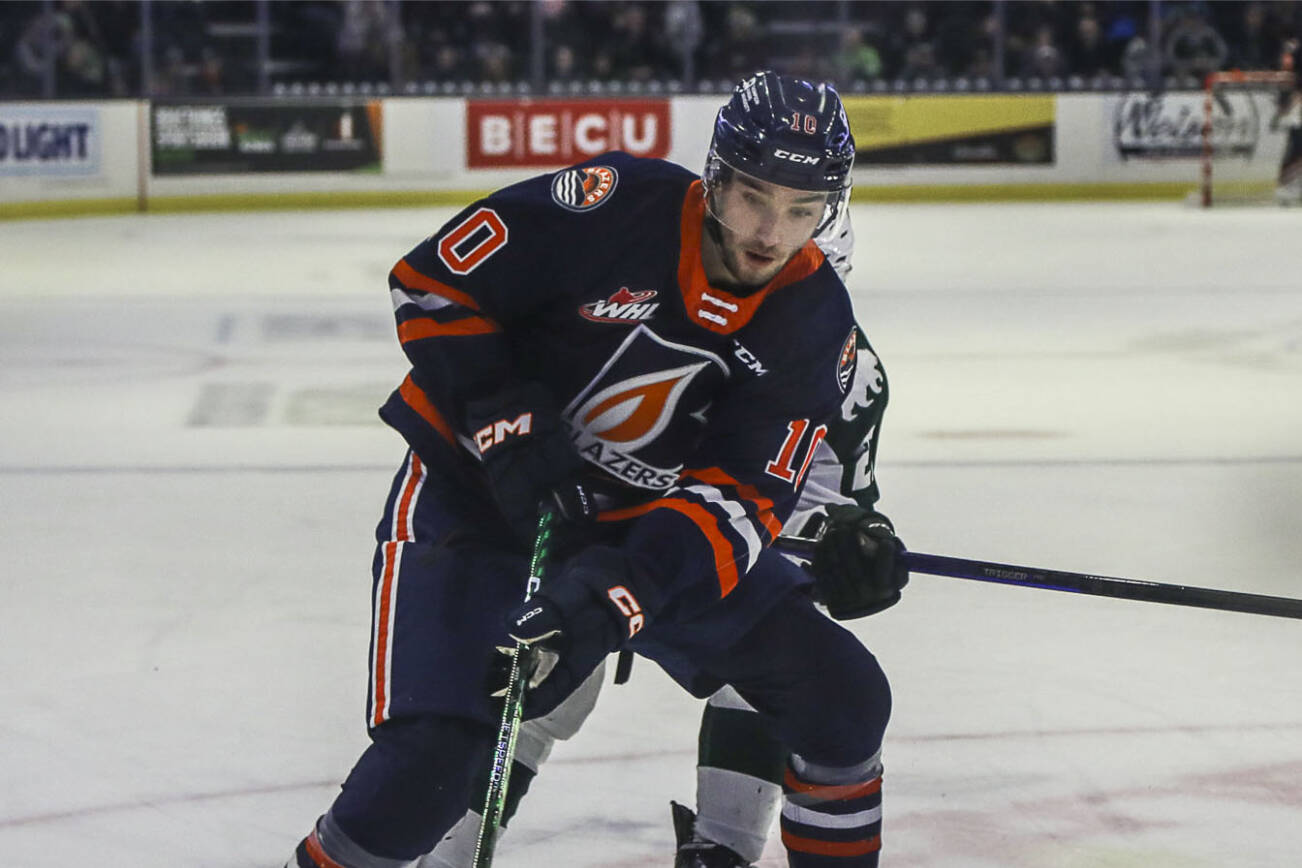 Kamloops’ Ryan Hofer (10) and Silvertips’ Beau Courtney (10) fight for the puck during a game between the Silvertips and Kamloops Blazers at the Angel of the Winds Arena on Friday, Jan. 13, 2023. The Silvertips fell to the Kamloops, 3-6. (Annie Barker / The Herald)