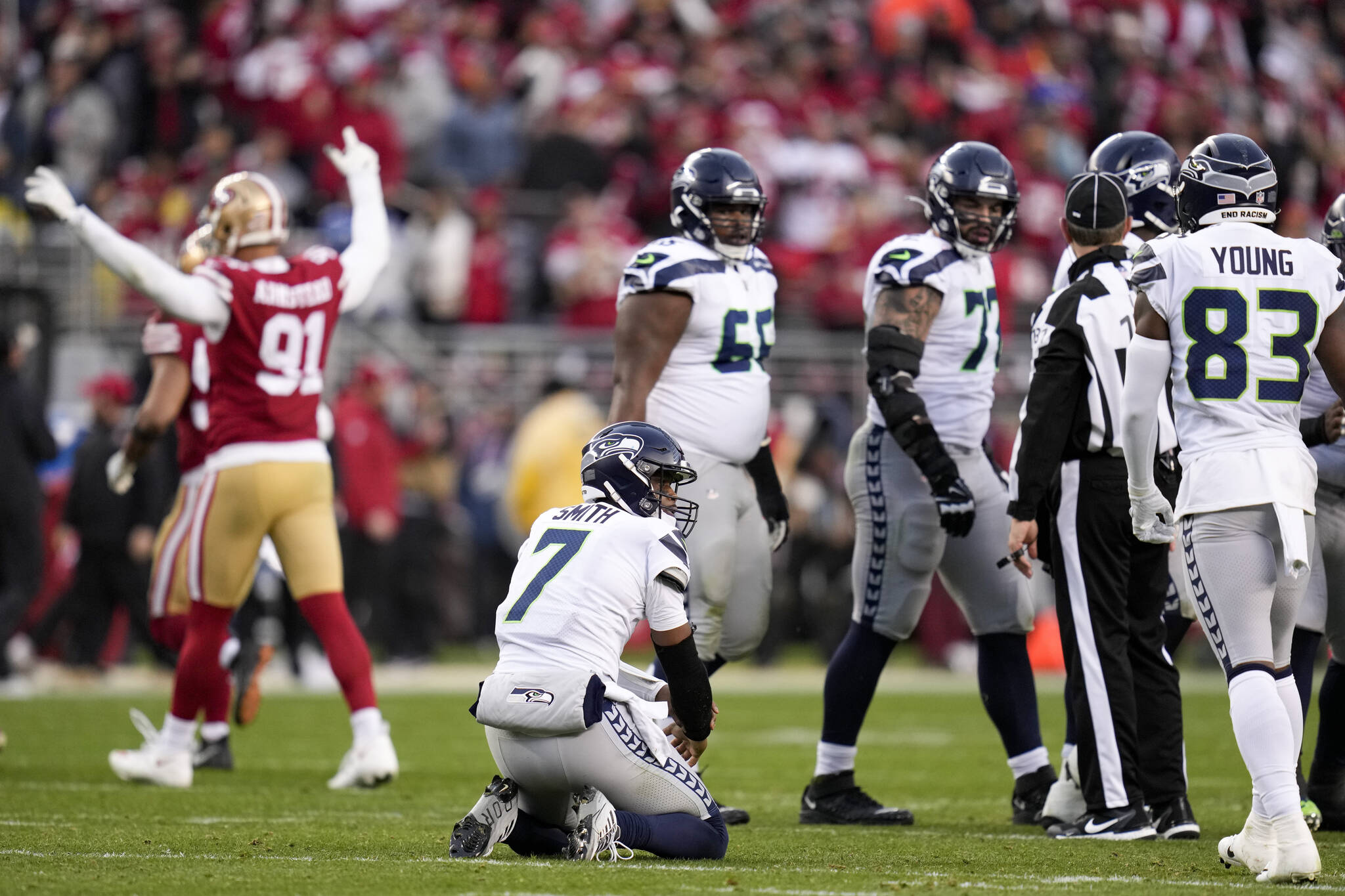 Seattle Seahawks quarterback Geno Smith (7) reacts after losing a fumble against the San Francisco 49ers during the second half of Saturday’s NFL wild-card playoff football game in Santa Clara, Calif. (AP Photo/Godofredo A. Vásquez)