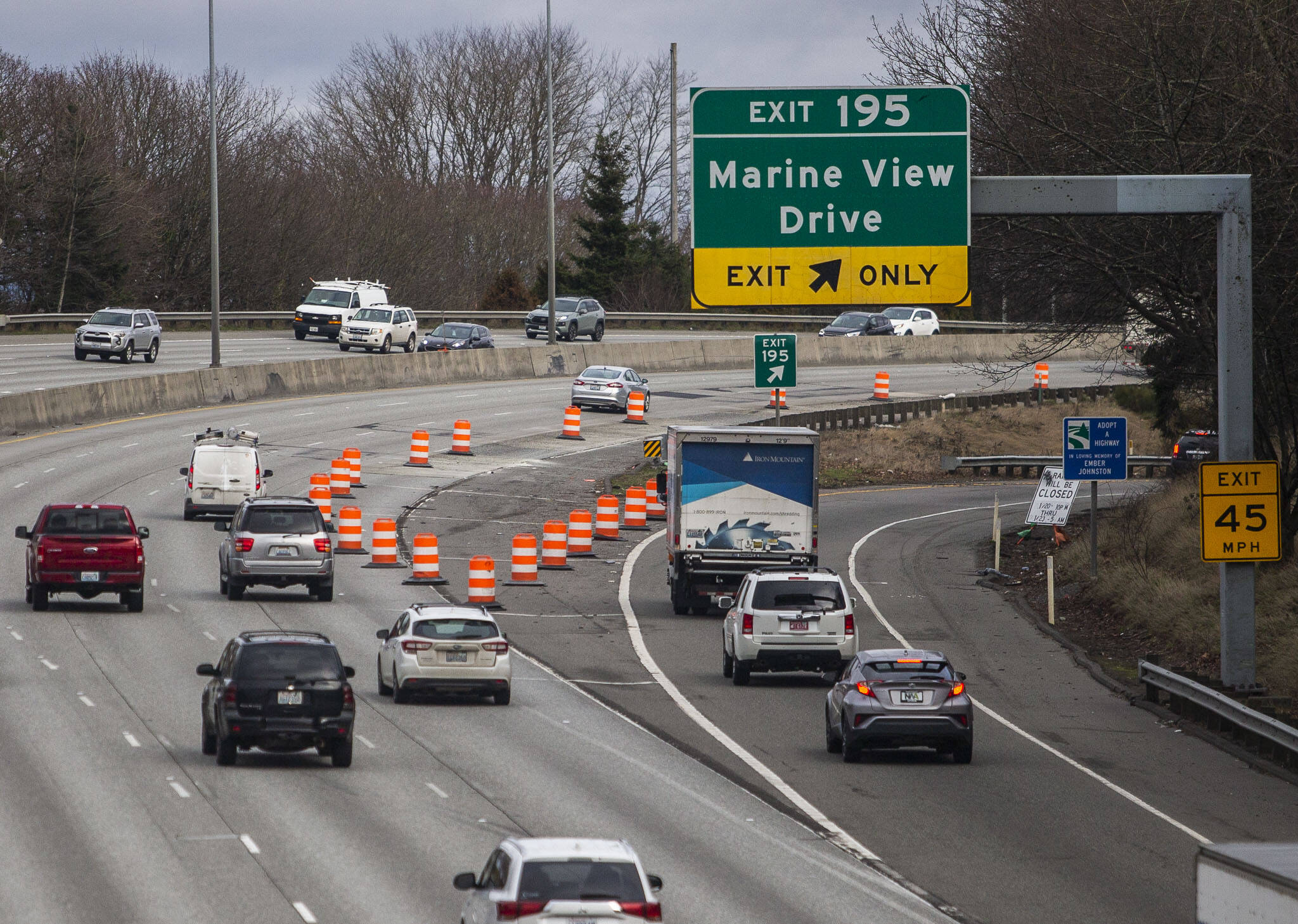 Orange traffic barrels Tuesday direct drivers away from a section of Interstate 5 that lifted last week causing major traffic backups along the highway in Everett. (Olivia Vanni / The Herald)