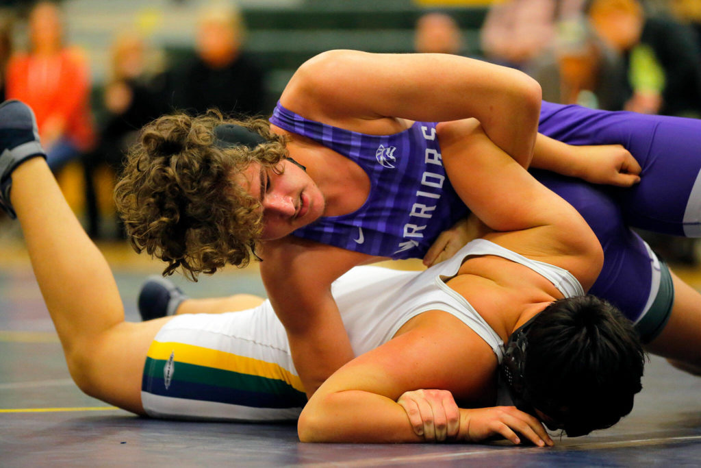 Edmonds-Woodway’s Mika Serafinas controls Shorecrest’s Mateo Dominguez before winning with a pin on Wednesday, Jan. 18, 2023, at Shorecrest High School in Shoreline, Washington. (Ryan Berry / The Herald)
